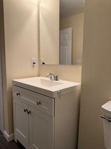 396 Brown Street Attleboro, MA 02703 - Photo 7 of 19 a bathroom with a sink and a mirror