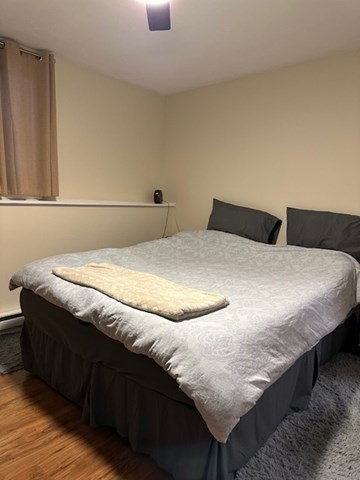 396 Brown Street Attleboro, MA 02703 - Photo 9 of 19 a bedroom with a bed and lamp