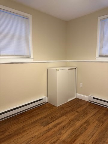 396 Brown Street Attleboro, MA 02703 - Photo 10 of 19 an empty room with wooden floor