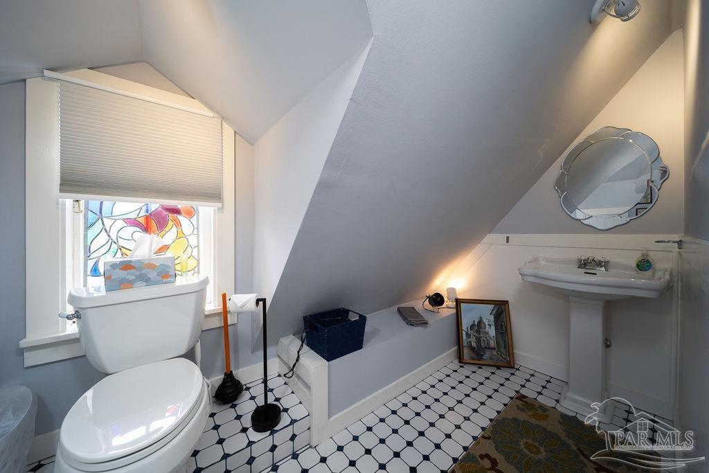 714 East La Rua Street Pensacola, FL 32501 - Photo 33 of 63 a bathroom with a toilet a sink and a mirror