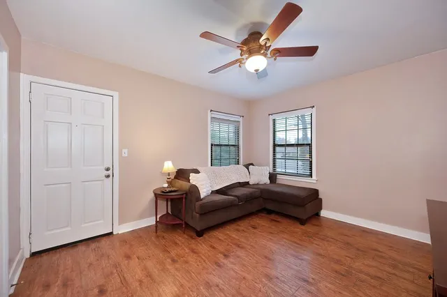 a bedroom with furniture and a window