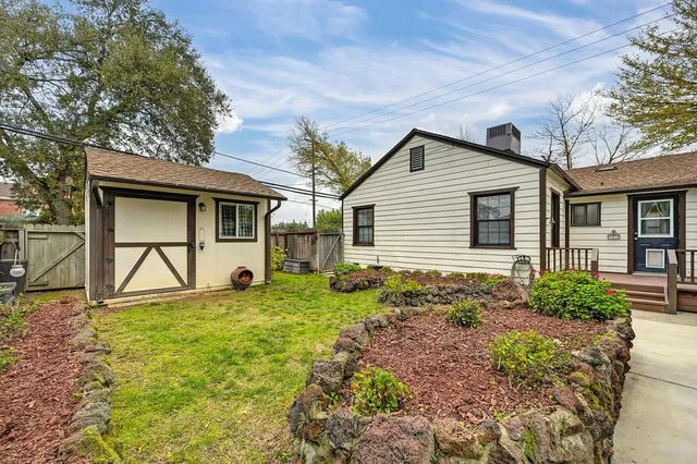 a house view with a backyard space