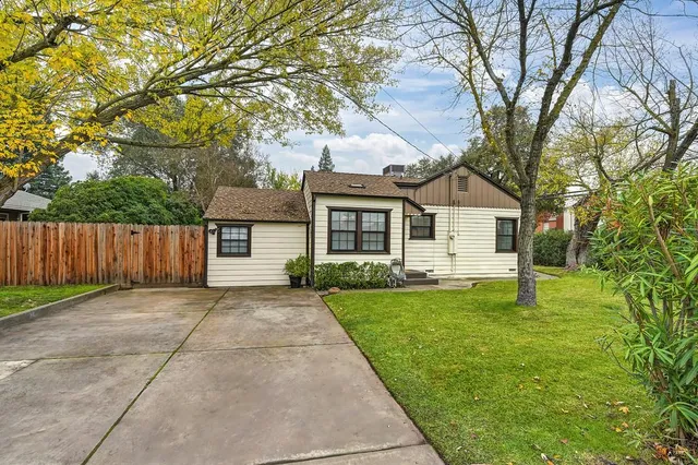a front view of a house with yard