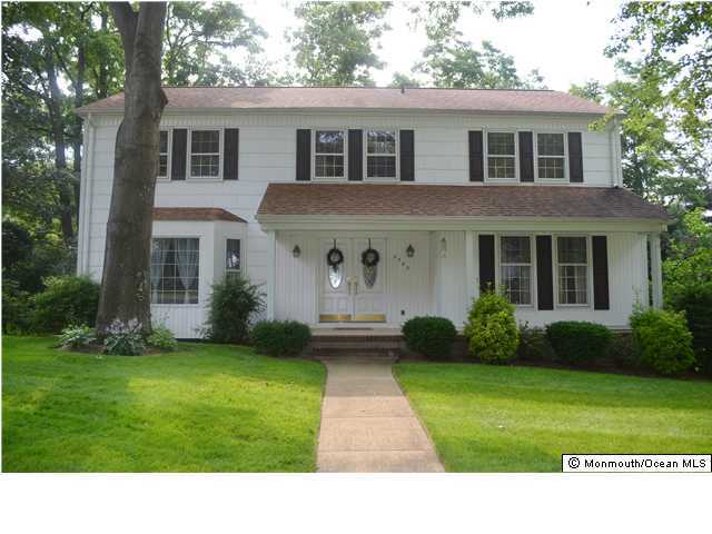 2565 Summit Road Manasquan, NJ 08736 - Photo 1 of 3 a front view of a house with garden