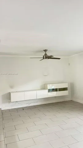 a kitchen with stainless steel appliances granite countertop a sink and a refrigerator