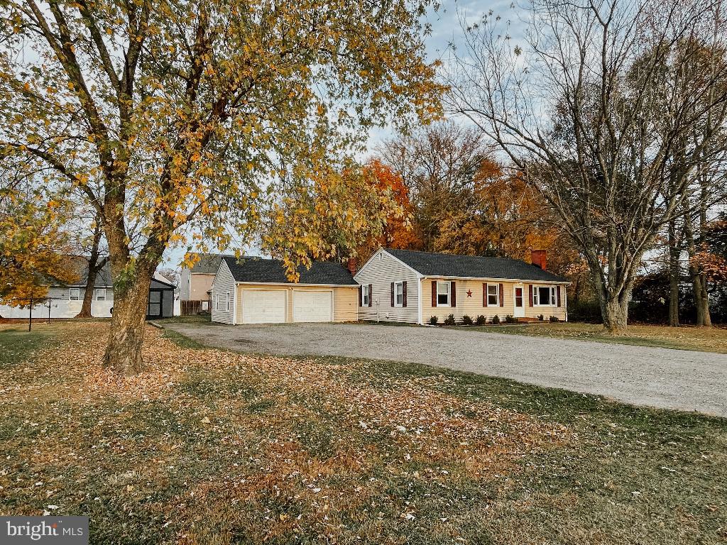 9585 Legion Road Denton, MD 21629 - Photo 1 of 25 front view of a house with a yard