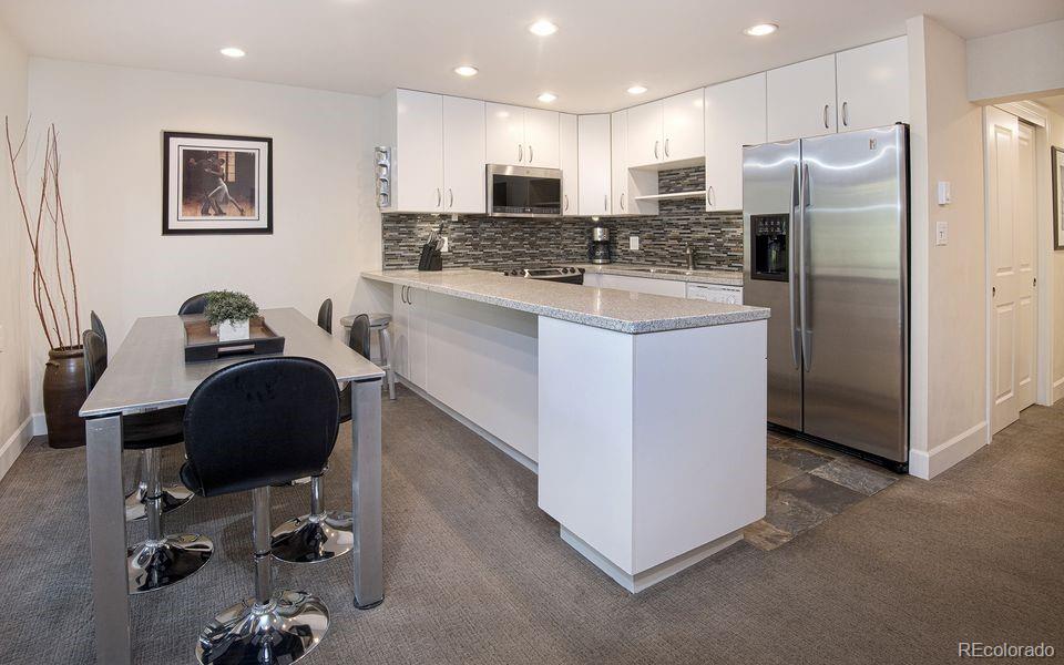 4660 Vail Racquet Club Drive, Unit 2 Vail, CO 81657 - Photo 1 of 15 a kitchen with a refrigerator and a stove top oven