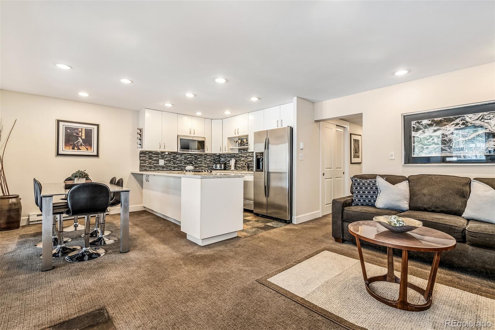 4660 Vail Racquet Club Drive, Unit 2 Vail, CO 81657 - Photo 2 of 15 a living room with furniture and kitchen view