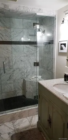 a bathroom with a sink and mirror