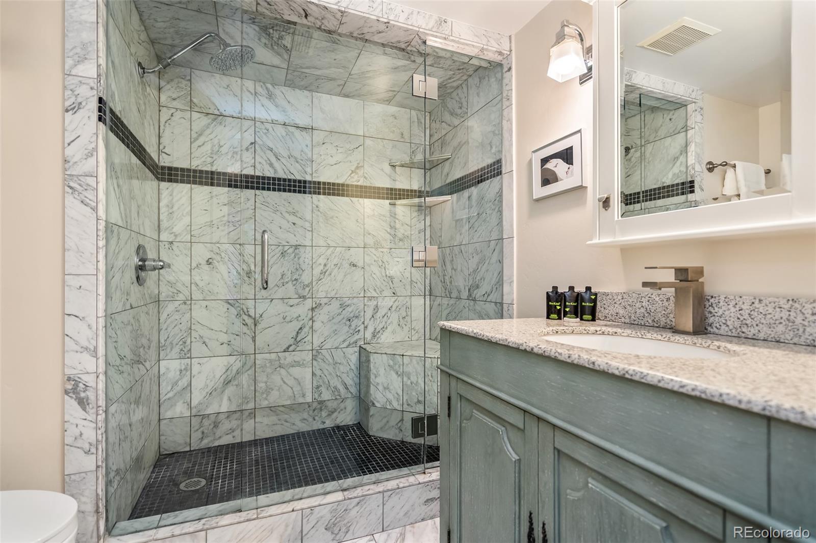 4660 Vail Racquet Club Drive, Unit 2 Vail, CO 81657 - Photo 6 of 15 a bathroom with a sink and a mirror