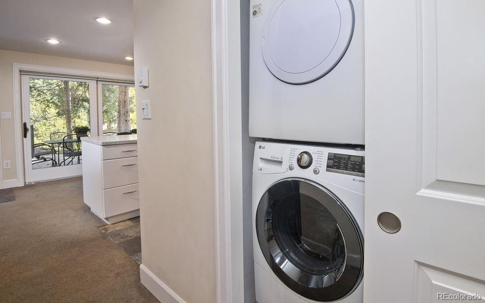4660 Vail Racquet Club Drive, Unit 2 Vail, CO 81657 - Photo 9 of 15 a view of a hallway with washer and dryer