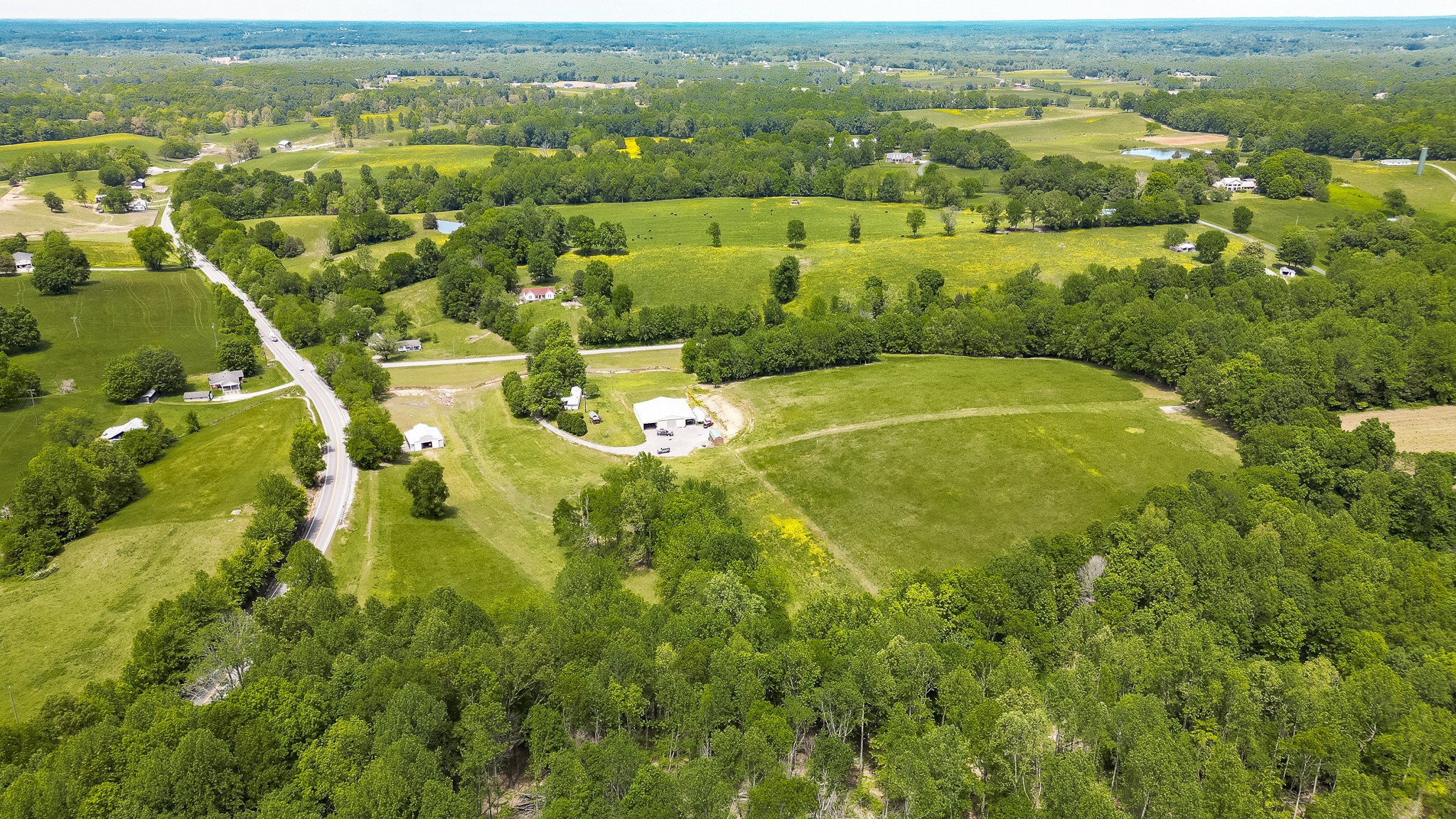 110 Womack Road Portland, TN 37148 - Photo 11 of 44 an aerial view of residential houses with outdoor space and trees