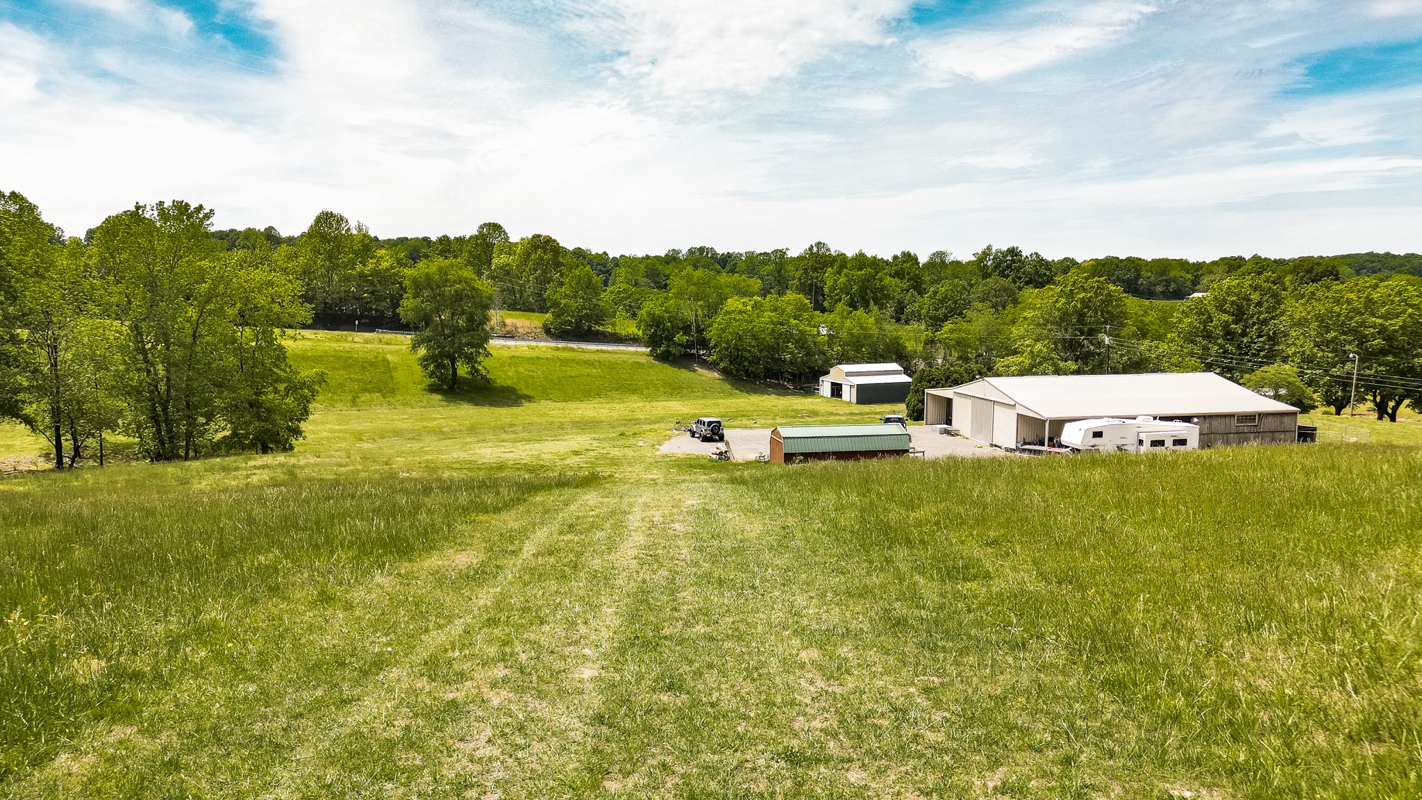 110 Womack Road Portland, TN 37148 - Photo 32 of 44 a view of a house with pool garden and outdoor seating