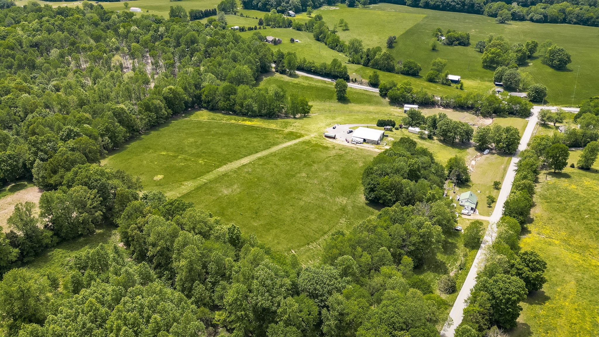 110 Womack Road Portland, TN 37148 - Photo 8 of 44 a view of a lush green field