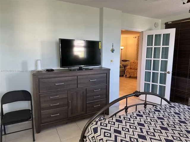 a bathroom with a sink vanity and mirror