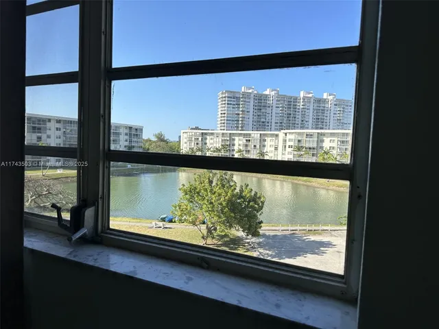 a bathroom with a sink a toilet a mirror and shower