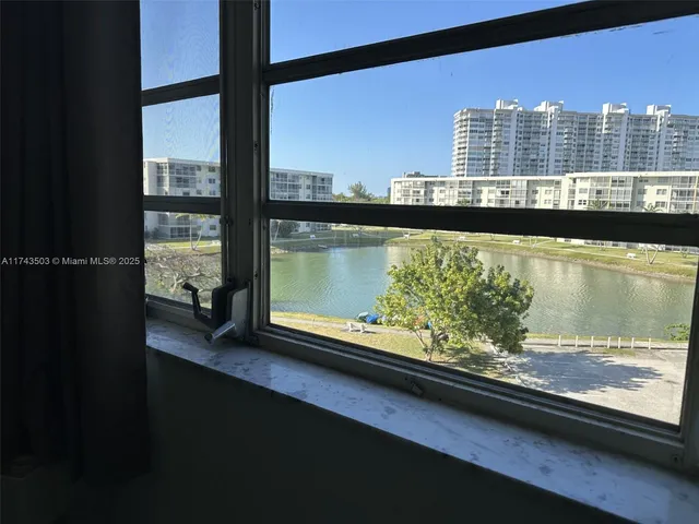 a view of a balcony with chair and table