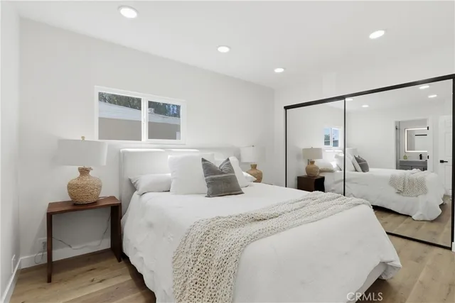 a bedroom with bed and a couch