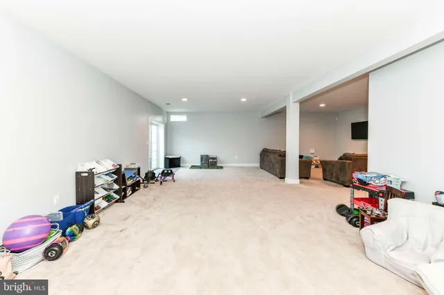 a view of a swimming pool with an outdoor space and seating area