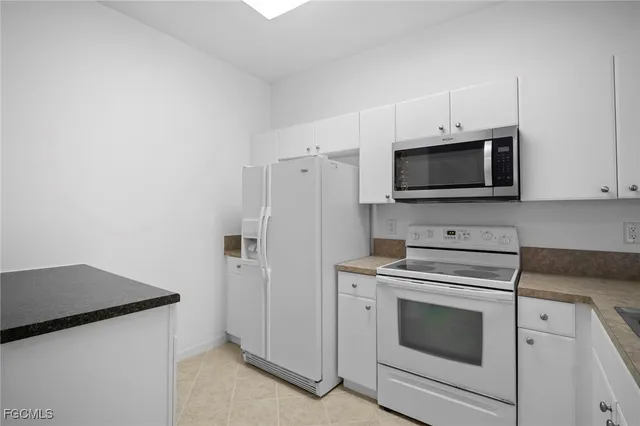 a kitchen with a stove and a microwave