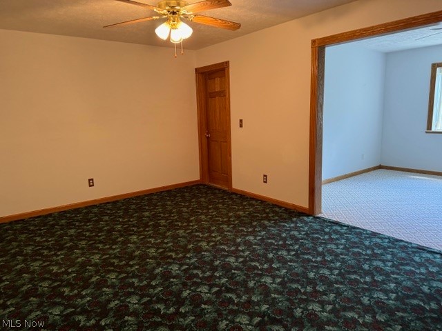6900 North Ridge Road East Geneva, OH 44041 - Photo 13 of 37 Carpeted empty room with ceiling fan