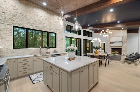 a view of a patio with a table chairs and a backyard