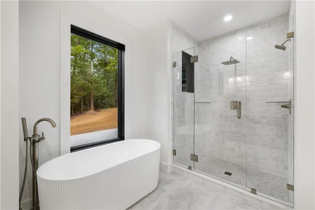 a bathroom with a shower and toilet