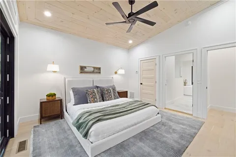 a bedroom with a bed and a lamp