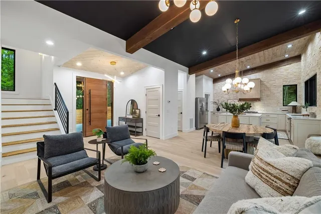 a kitchen with stainless steel appliances granite countertop a sink stove and cabinets
