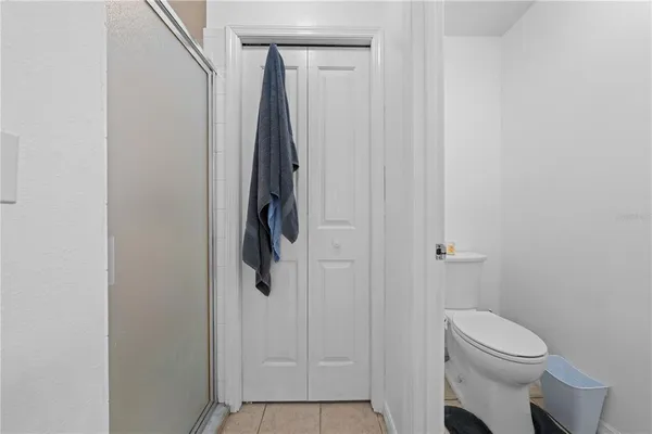a bathroom with a shower and toilet