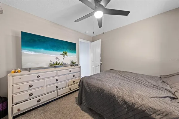 a bedroom with a bed and a dresser