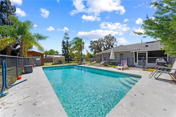 a view of a swimming pool with a patio