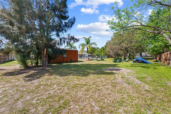 a view of a tree in front of a house