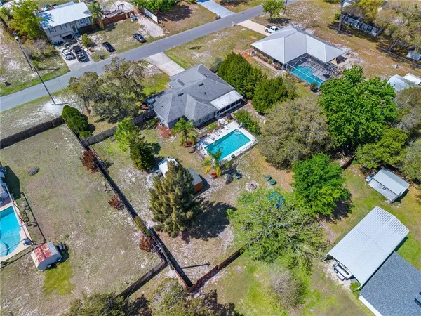 an aerial view of residential house with outdoor space