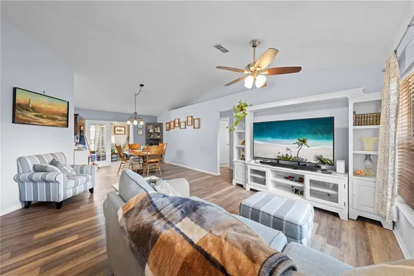 a living room with furniture fireplace and a flat screen tv