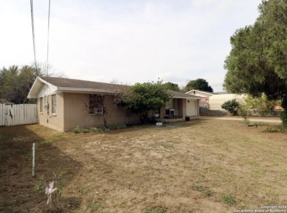 1603 1st Street Zapata, TX 78076 - Photo 2 of 11 a house view with a backyard space