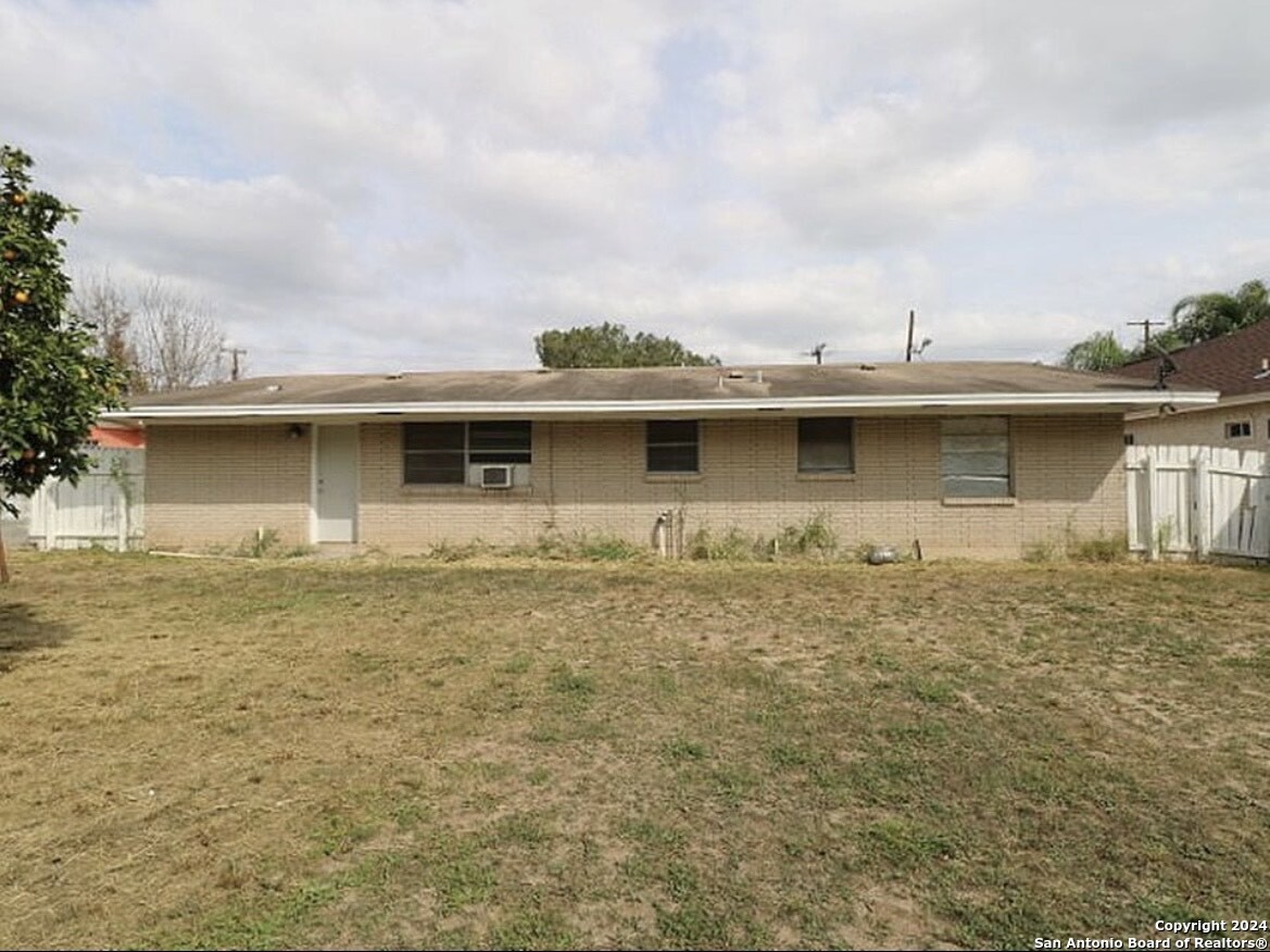 1603 1st Street Zapata, TX 78076 - Photo 10 of 11 a view of a house with a backyard