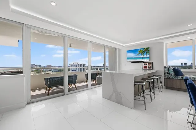 a balcony with furniture and city view