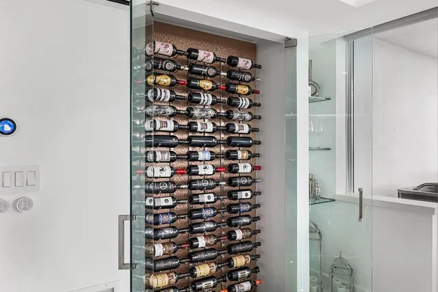 a living room with furniture and kitchen view