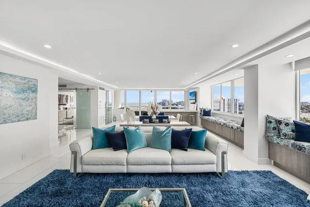 a bathroom with a granite countertop shower and a sink
