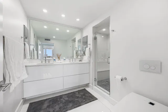 a bedroom with a bed and lamp