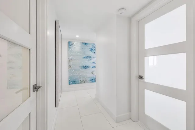 a view of a balcony with chair and table