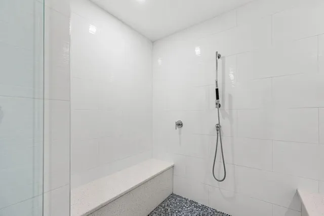 a bedroom with a bed and a walk in closet