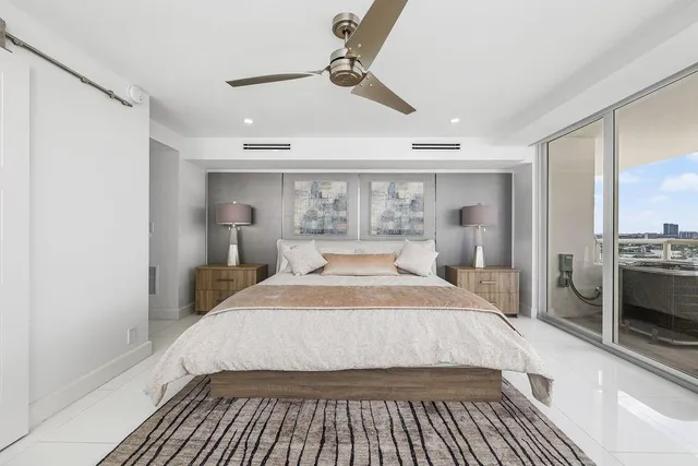 a bedroom with a large bed and a window