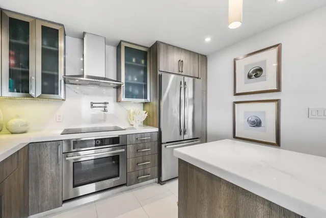 a living room with furniture a rug and a floor to ceiling window