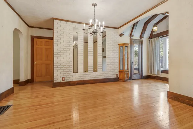a view of livingroom with hallway and wooden floor