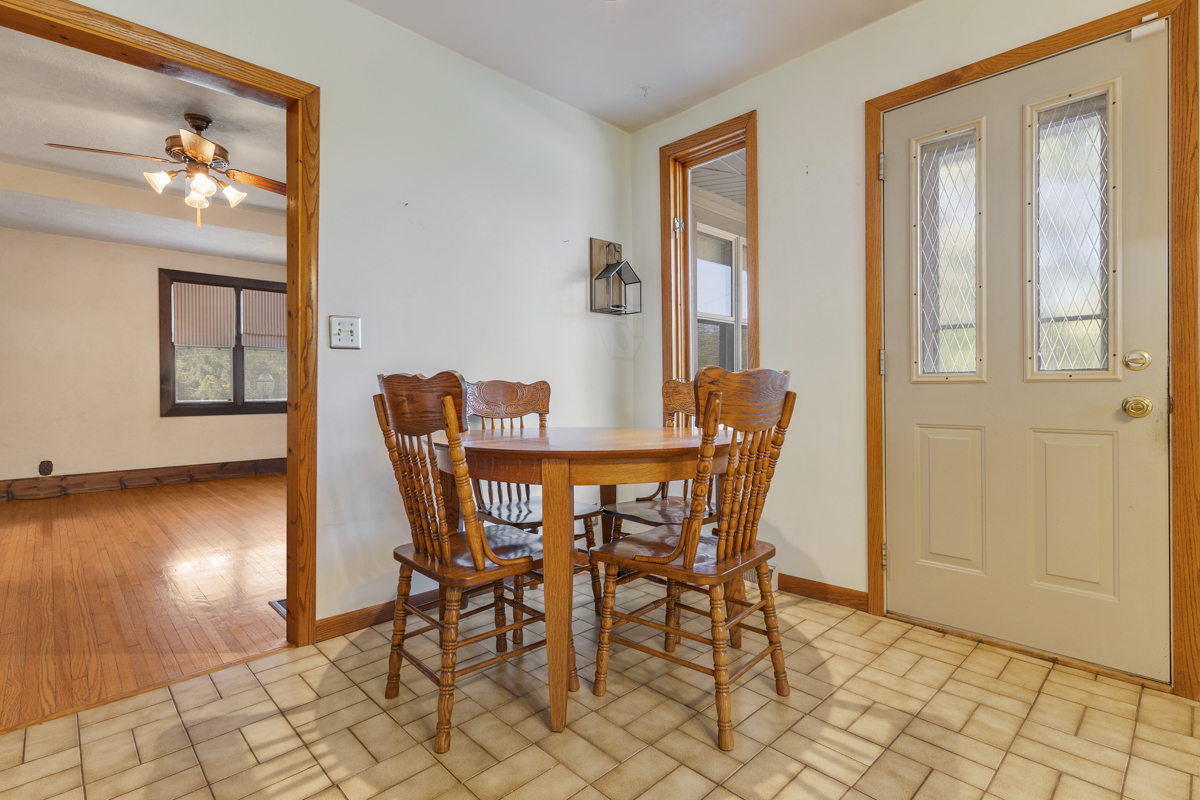 18633 Main Street Mokena, IL 60448 - Photo 18 of 24 a dining room with furniture and wooden floor
