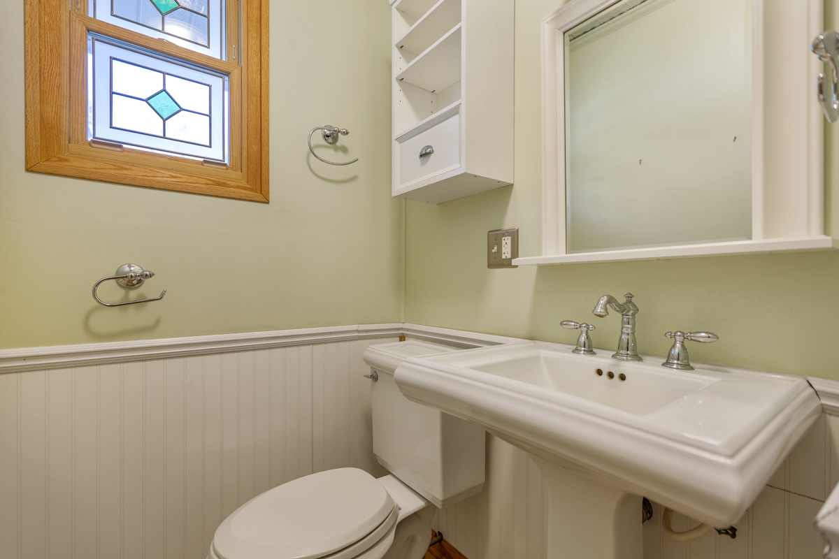 18633 Main Street Mokena, IL 60448 - Photo 20 of 24 a bathroom with a sink mirror and toilet