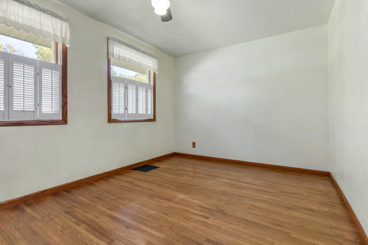 18633 Main Street Mokena, IL 60448 - Photo 23 of 24 an empty room with wooden floor and windows