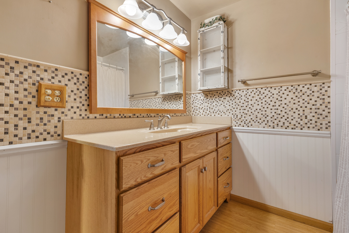 18633 Main Street Mokena, IL 60448 - Photo 24 of 24 a bathroom with a sink and a mirror